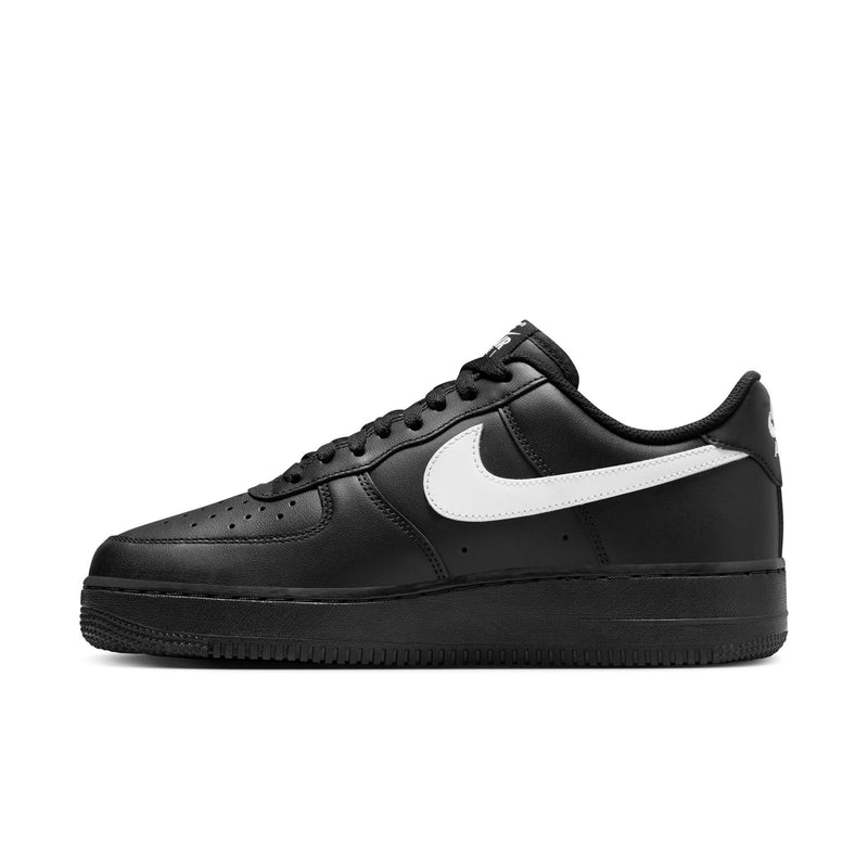 Nike Air Force 1 Low black leather sneaker with white swoosh, side profile