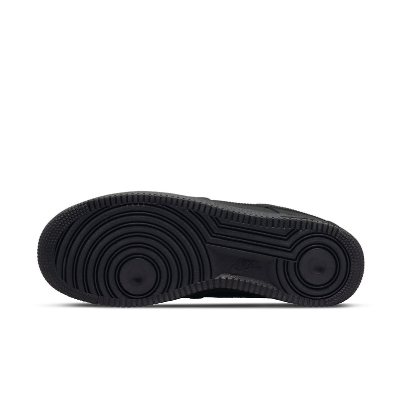 Black rubber outsole with deep circular tread pattern