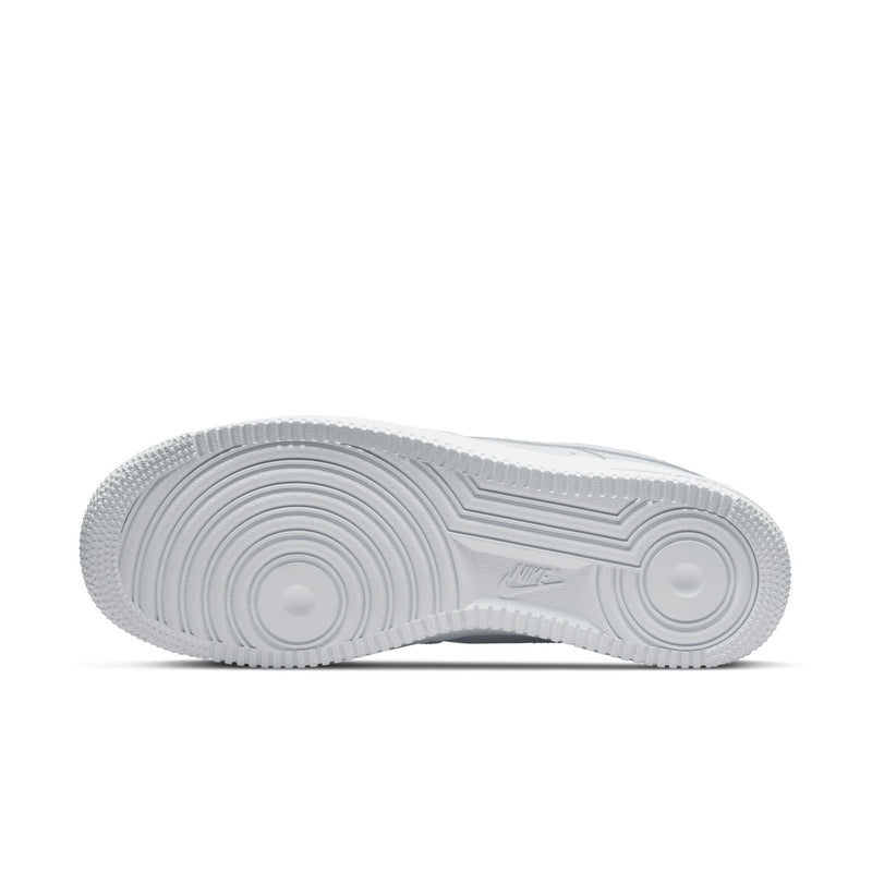 White rubber outsole with circular traction pattern and textured tread