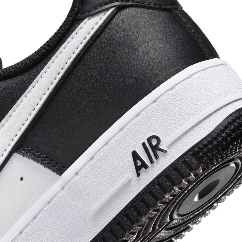 Nike Air Force 1 Low black upper with white stitched panel and Air midsole detail