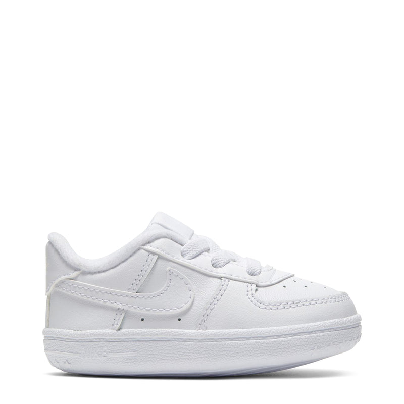 Infant white low-top lace sneakers with Nike swoosh and padded collar