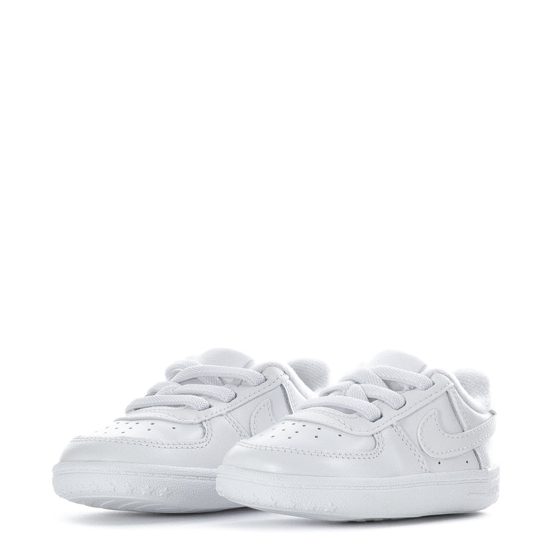 Pair of infant white low-top sneakers with Nike swoosh and lace-up design