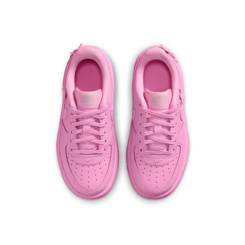 Kids' pink low-top lace sneakers, front view with laces and perforated toe