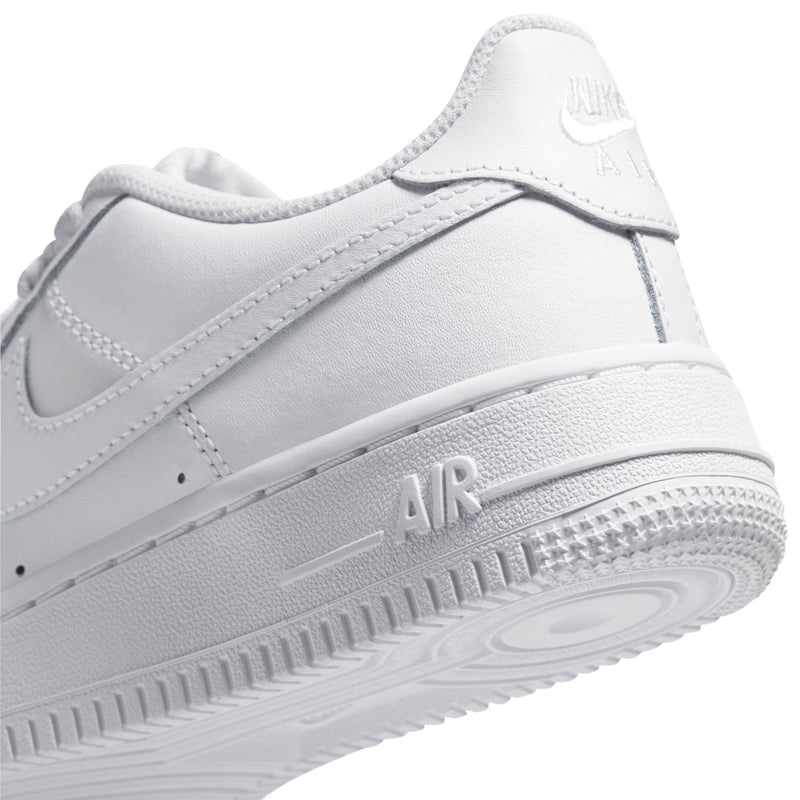 Close-up youth low-top sneaker side, white leather with AIR midsole branding