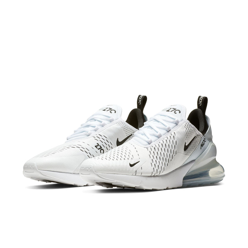 Men's white low-cut sneakers with black heel pull tab, Air sole, and Nike swoosh