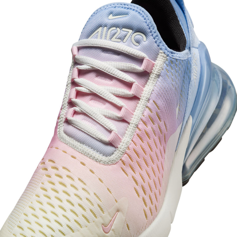 Close-up of pink and light-blue knit upper with white laces and swoosh
