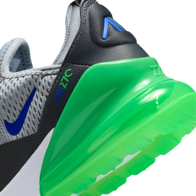 Close-up: black side panel with blue swoosh and glossy bright green heel Air unit