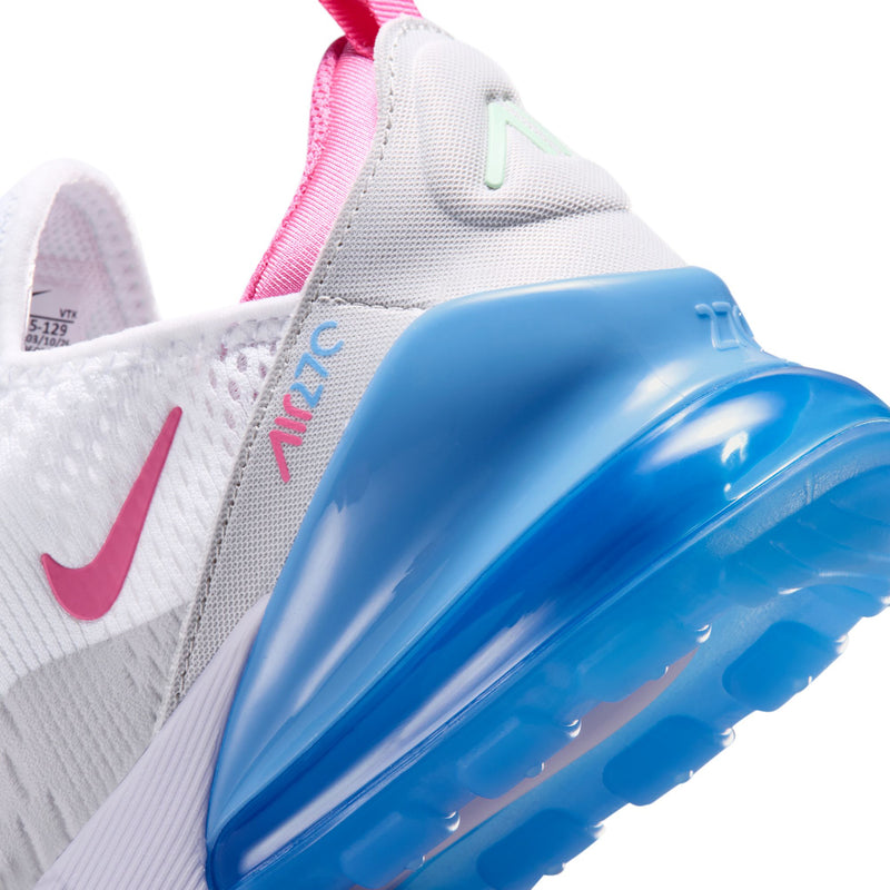 Youth sneaker close-up showing white side panel, pink collar, and glossy blue heel unit