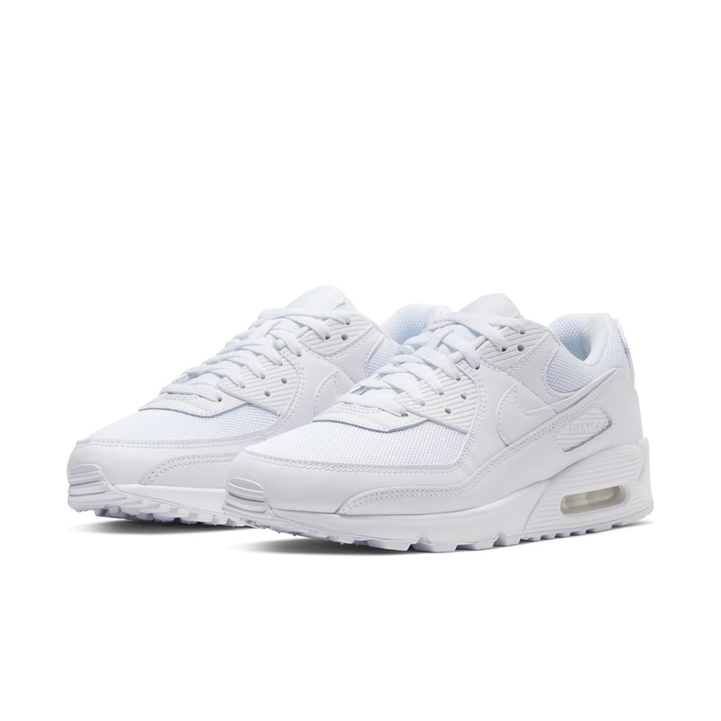 White lace-up sneakers with gray logo details and visible air window in midsole