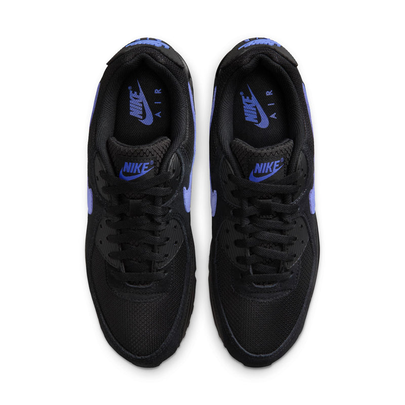 Pair of black sneakers with blue Nike Air logo on tongue and inside lining
