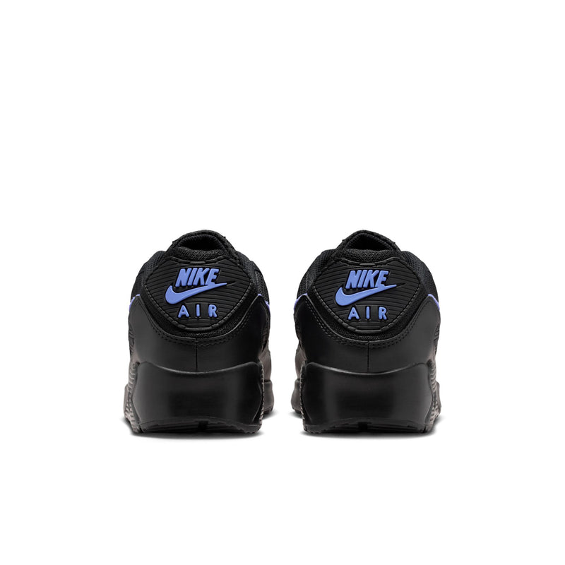 Black sneakers with Nike Air branding on the heel and lace-up collar