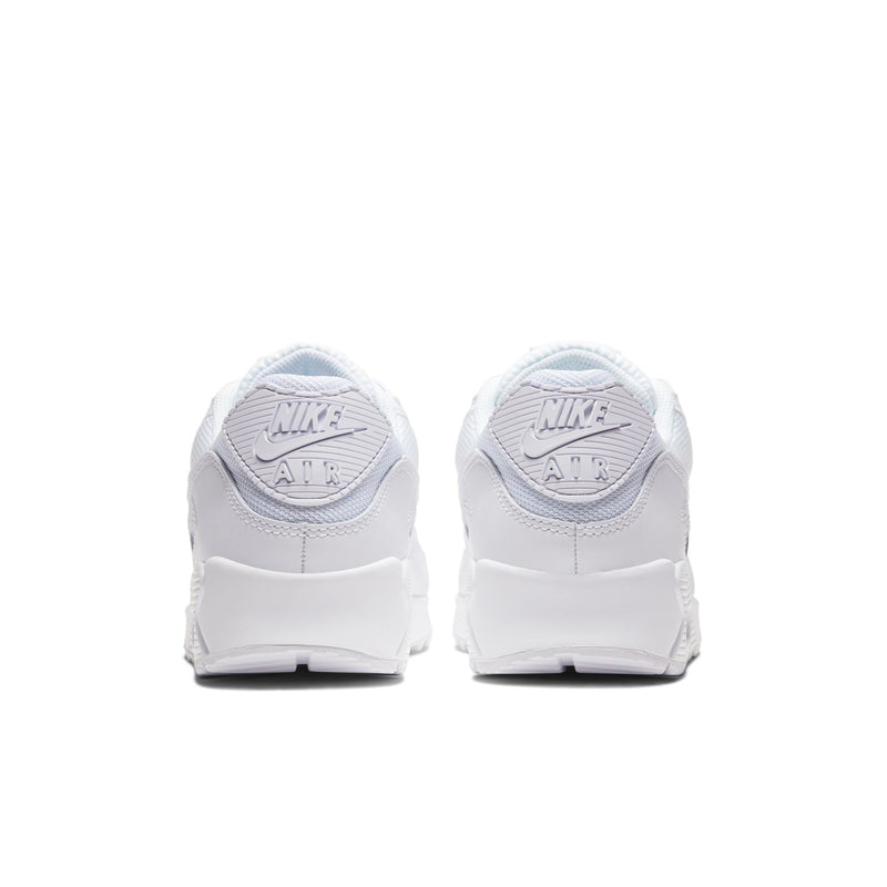 Back view of white sneakers with heel branding and lace-up closure