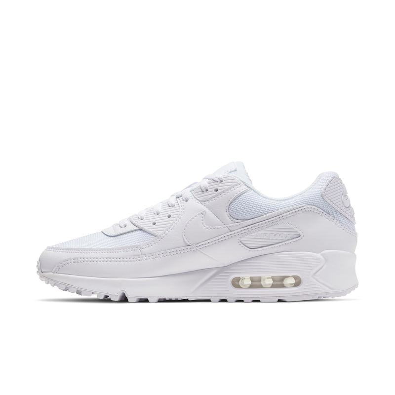 White lace-up sneaker with gray Swoosh, padded collar, and air-cushioned midsole