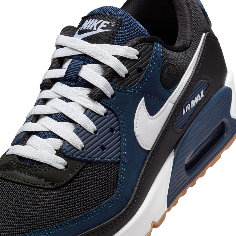 Men's Nike Air Max 90 sneaker close-up, blue/black mesh with white swoosh and Air Max badge