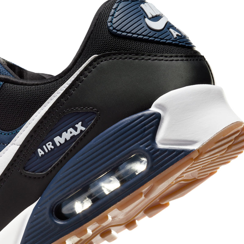 Men's Nike Air Max 90 sneaker side view, black/blue upper with visible Air window and gum sole