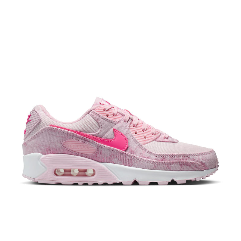 Women's pink Air Max 90-style running shoe with pink swoosh and white air-cushion sole