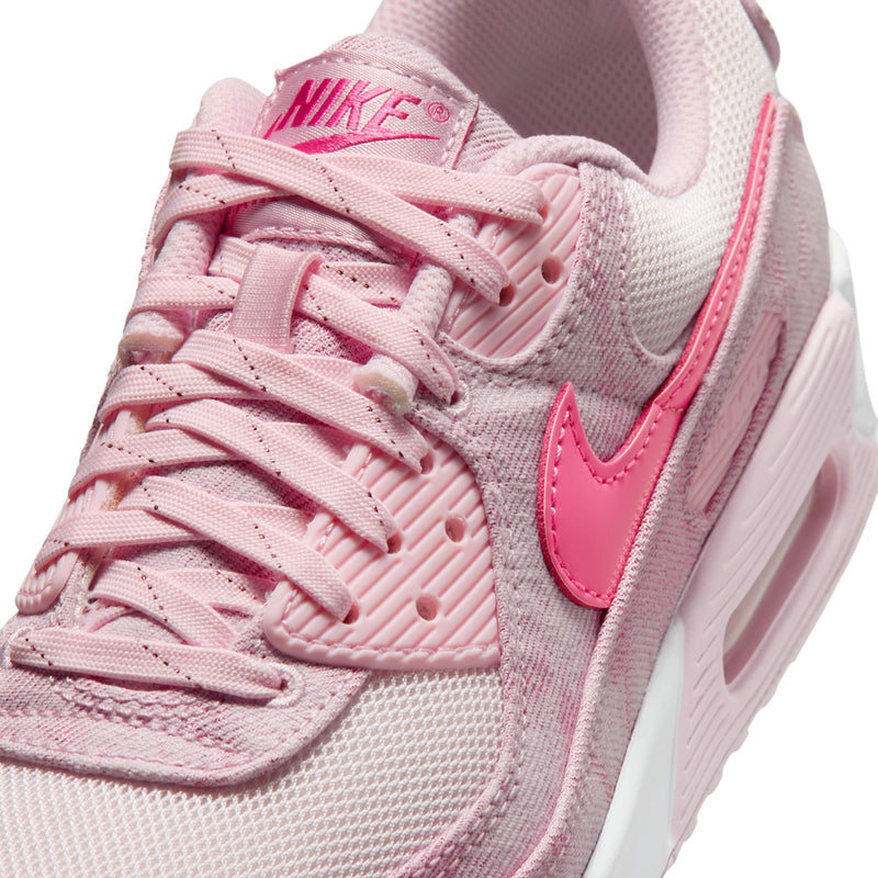 Close-up of pink Air Max 90-style sneaker upper with laces and stitched swoosh