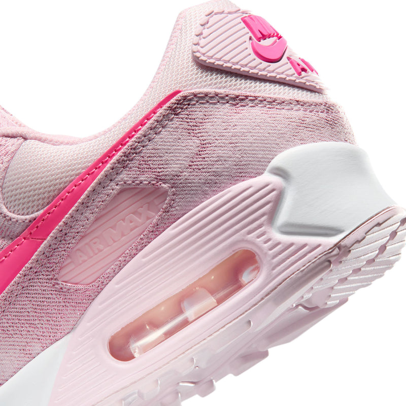 Close-up of pink Air Max 90-style shoe side and air-cushion window in white sole