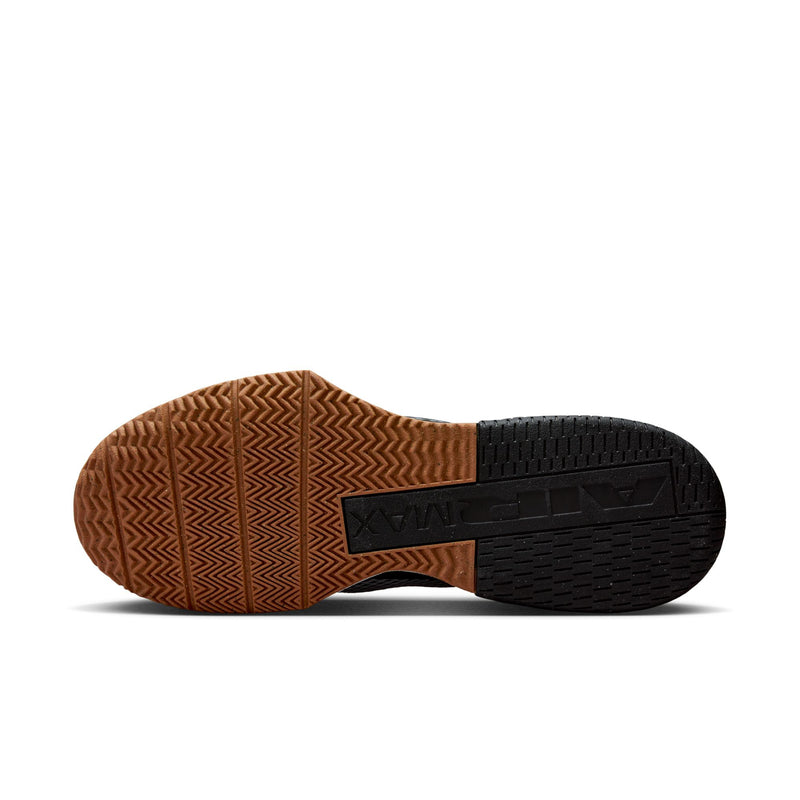 Outsole view with brown traction tread and black heel section on a men's trainer