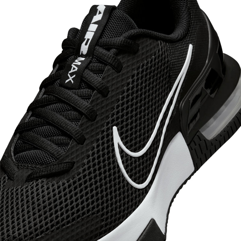Close-up of men's black mesh training sneaker with white swoosh and laces