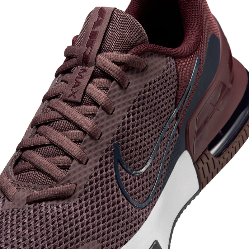 Close-up of burgundy mesh upper with lace rows, navy swoosh, and X-shaped branding.