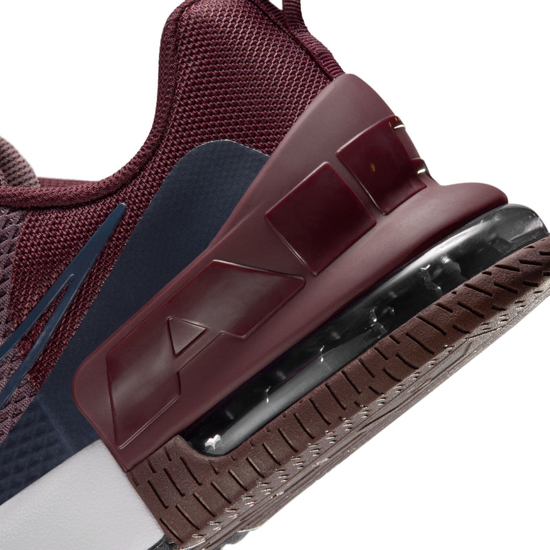 Close-up of burgundy heel with Air Max window and textured rubber outsole tread.