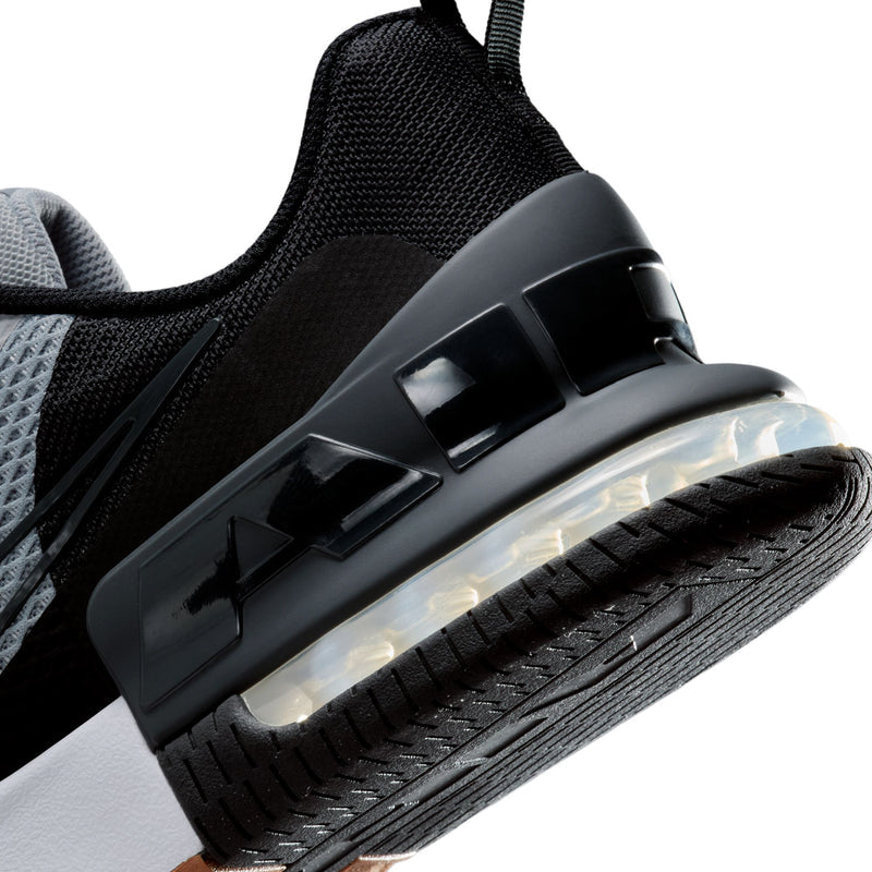 Heel close-up of men's trainer with black Air Max unit on gray and white upper