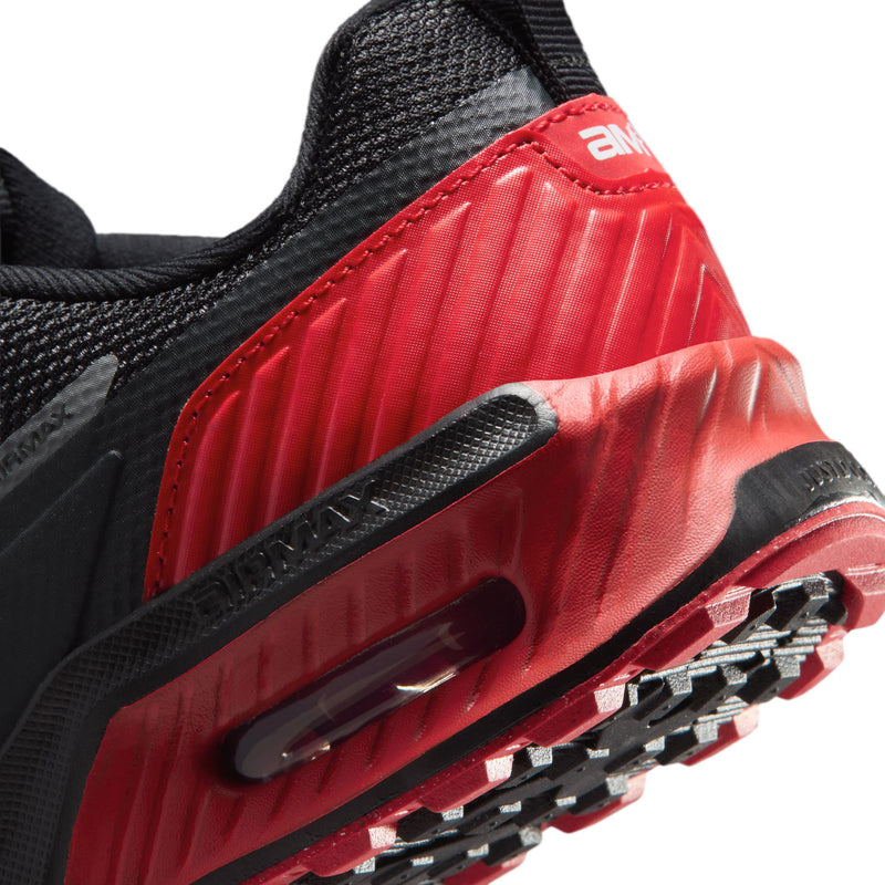 Close-up of red air unit midsole with black outsole lugs on youth sneakers