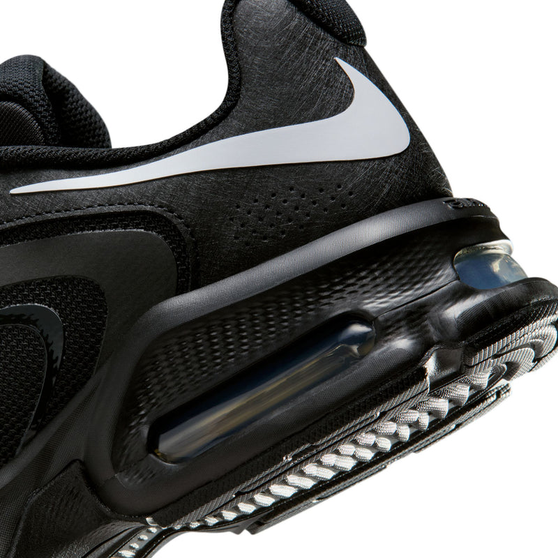 Men's black sneaker close-up of Air window with white Swoosh and lace area