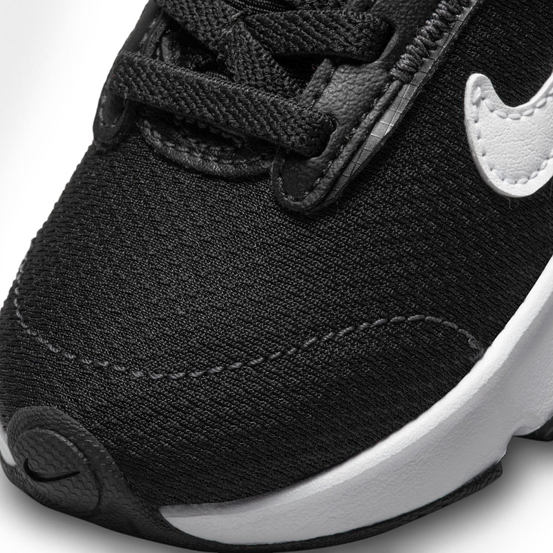 Black knit toddler sneaker close-up with white swoosh and stitched toe panel
