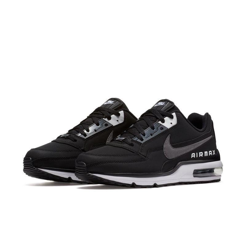 Men's black low-top sneakers with gray overlays, white midsole, and AIR MAX side logo