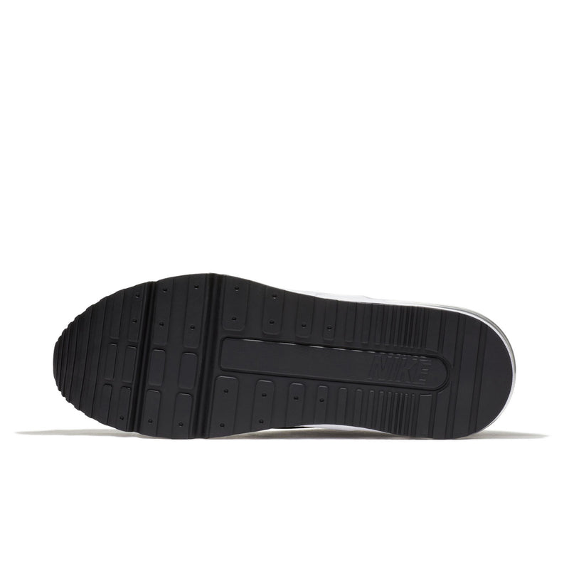 Black rubber outsole with tread pattern on men's low-top sneakers