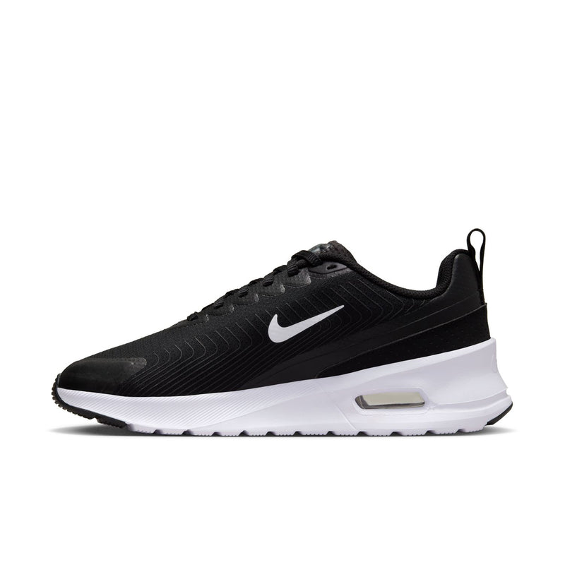 Black and white women's Nike sneakers, side profile with swoosh and Air unit