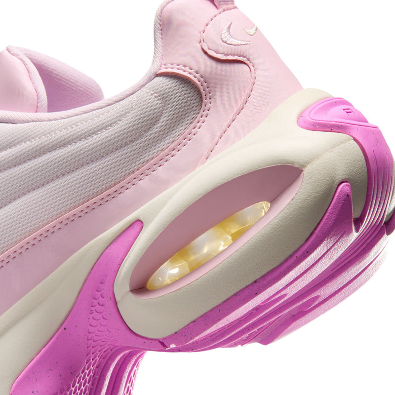 Close-up of women’s pearl pink sneakers showing side panel and translucent air window