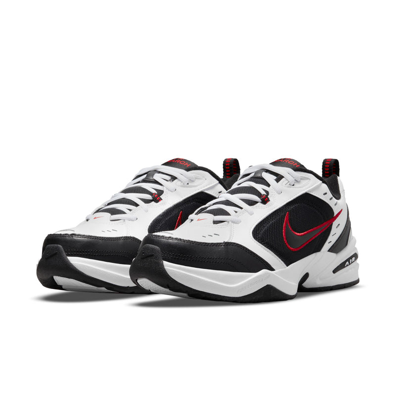 Pair of men’s athletic sneakers in white and black with red swoosh accents