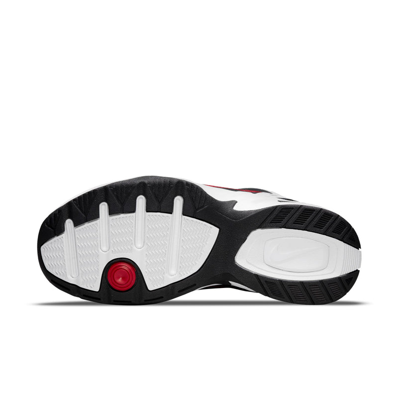 Outsole view of white and black men’s sneaker with patterned traction tread