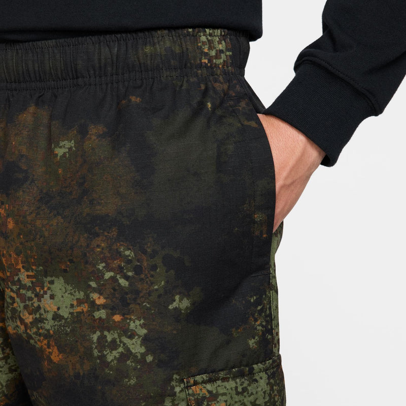 Men's woven camo pants close-up: elastic waistband and jogger cuff