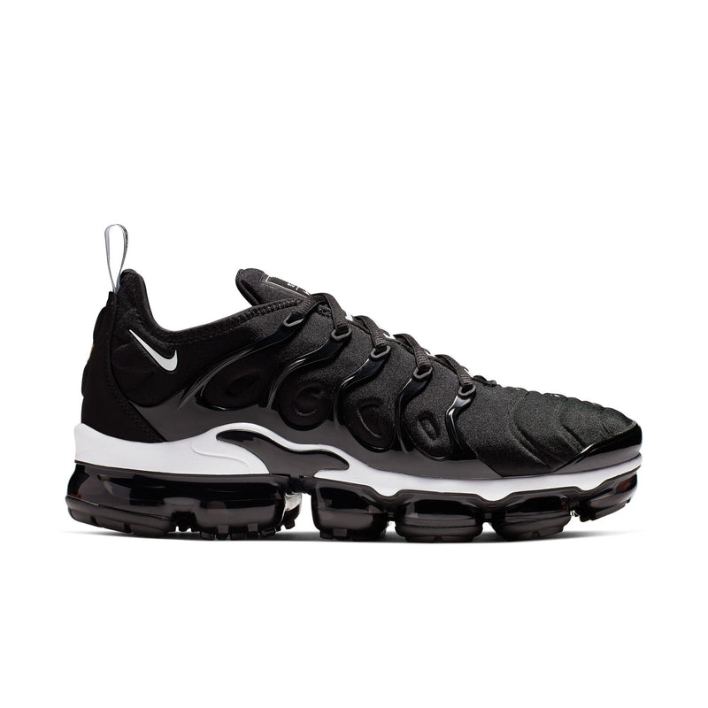 Men's black running shoes with white swoosh, sculpted midsole, and visible Air pods
