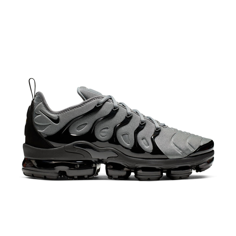 Air-cushion sneaker with cool grey knit upper, black lace-up, and visible black sole pods