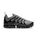 Air-cushion sneaker with cool grey knit upper, black lace-up, and visible black sole pods