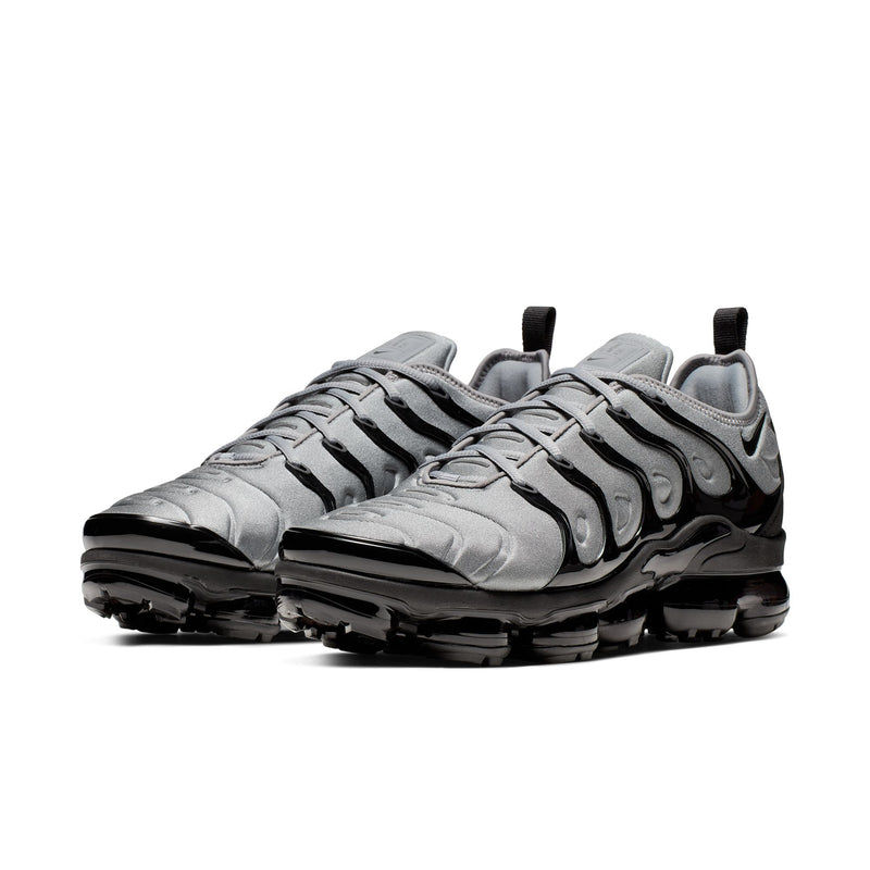 Air-cushion sneaker with cool grey upper, black trim, laced front, and treaded outsole