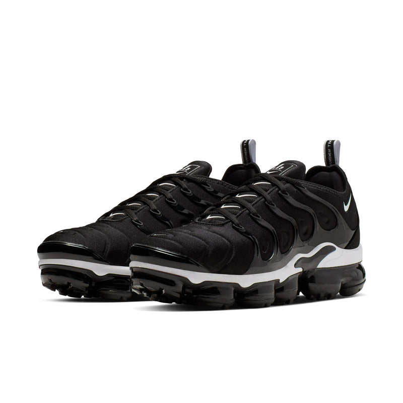 Men's black Nike running shoes with white midsole accents and grippy rubber outsole