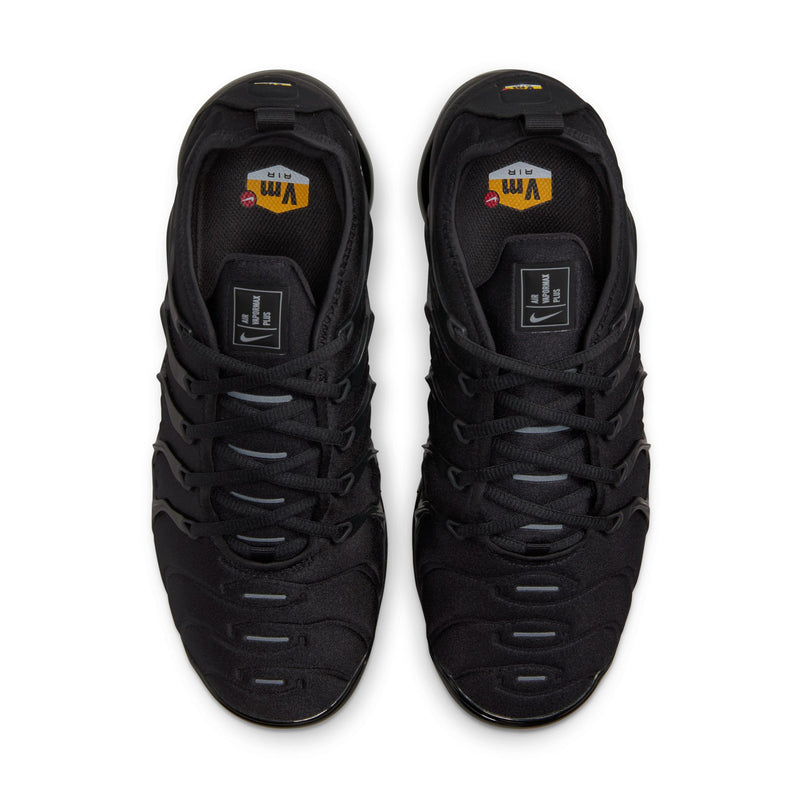 Men's black sneakers, top view with cushioned tongue and lace eyelets