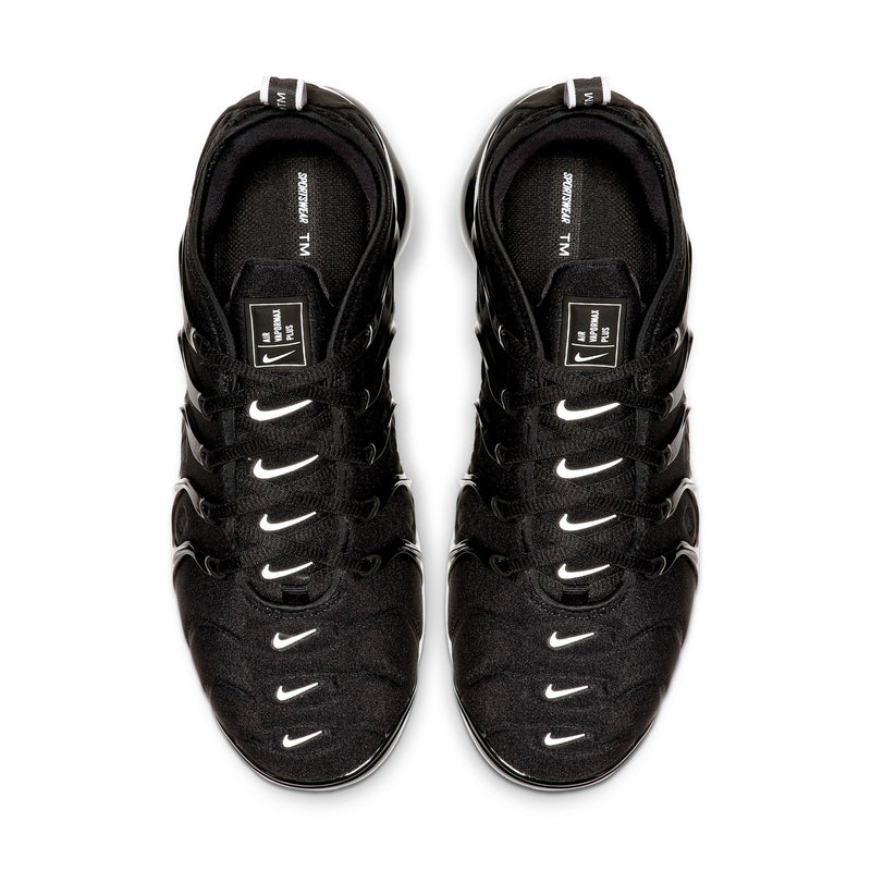 Pair of men's black lace-up running shoes with Nike swooshes on the uppers