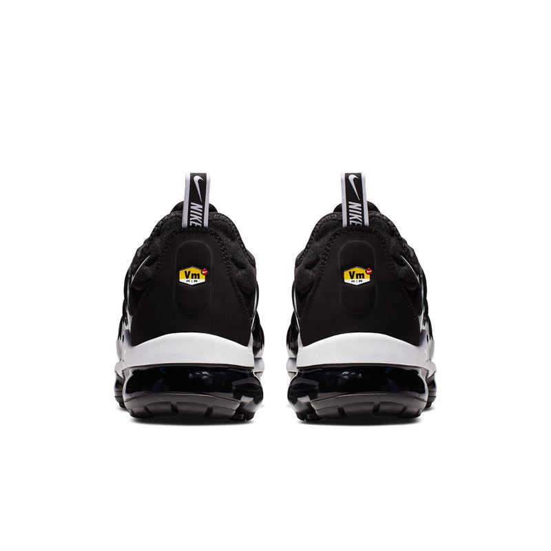 Men's black running shoes viewed from the back with white heel trim and Air cushioning