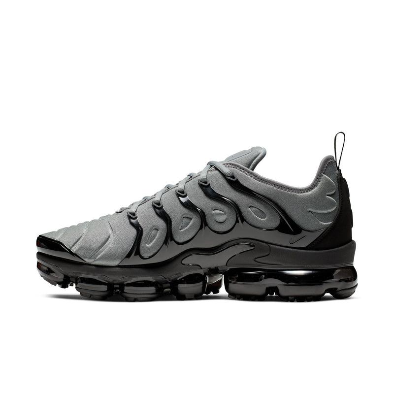 Air-cushion sneaker with cool grey upper, sculpted overlays, and black outsole