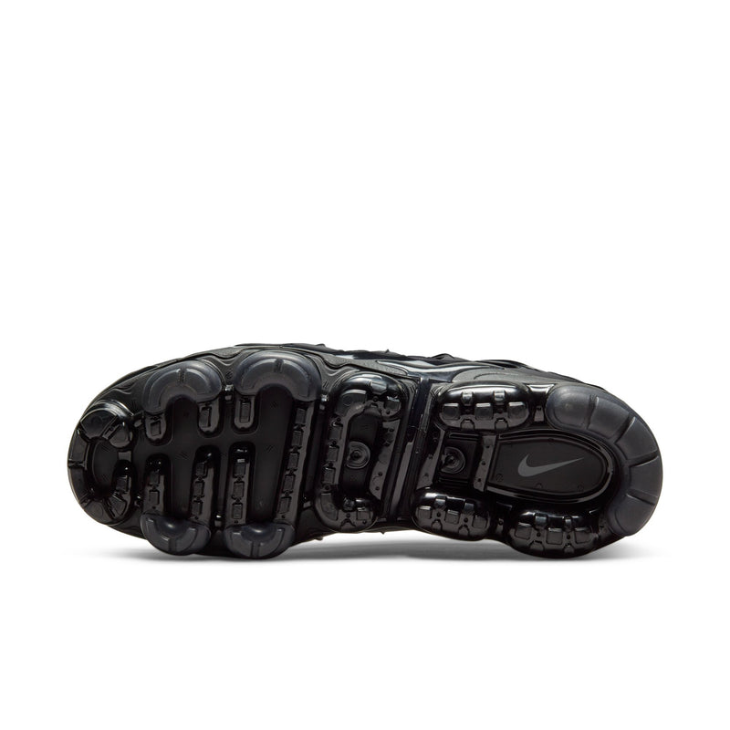 Men's black outsole view with tread pods and Air cushioning chambers