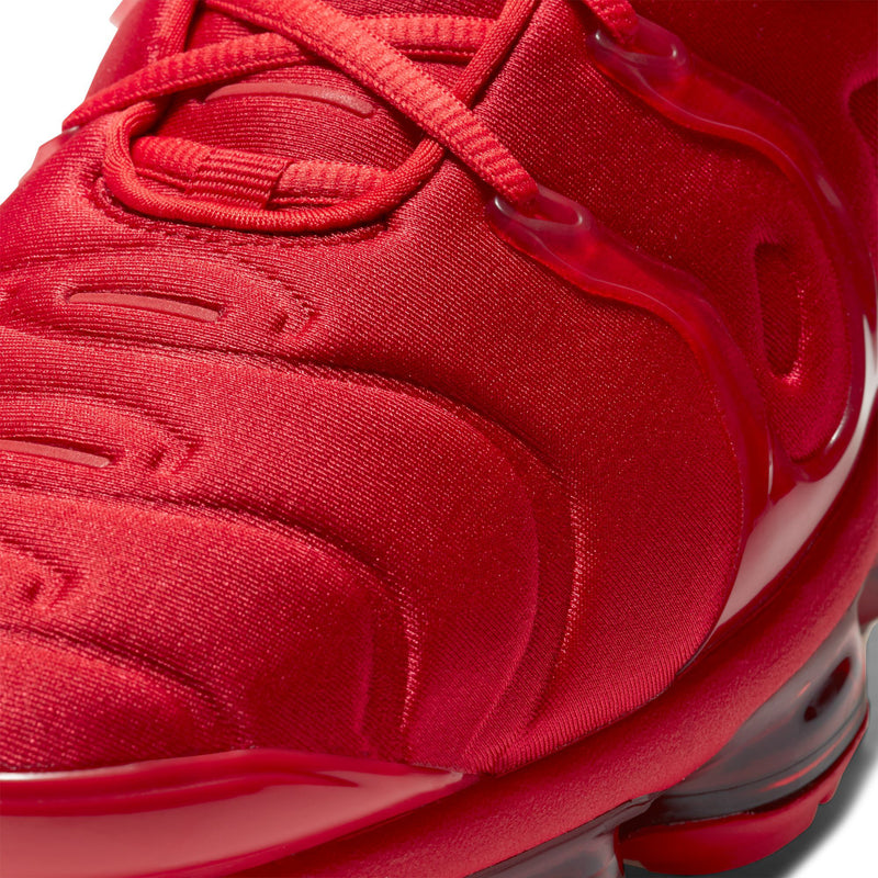 Close-up of men's red knit upper with lace eyelets and molded cushioning details.