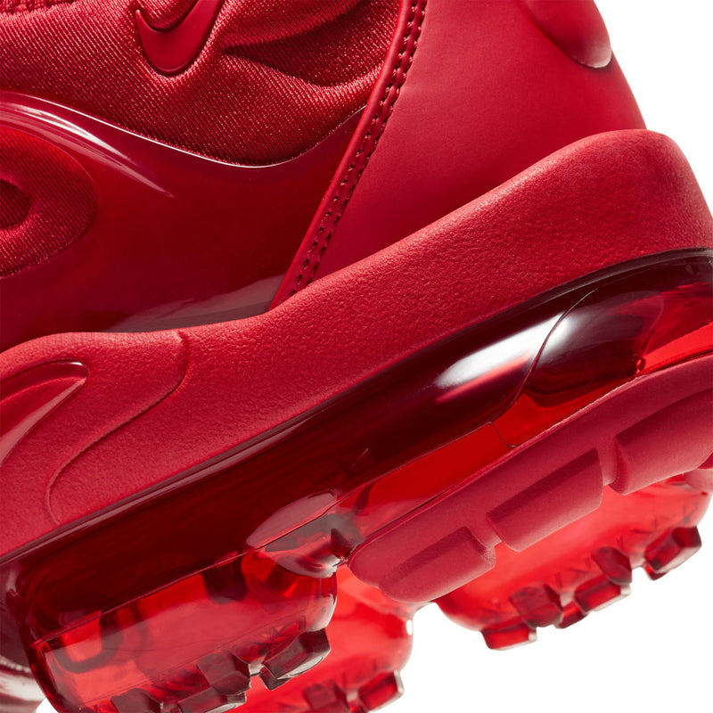 Close-up of men's red midsole and translucent Air outsole with traction pods.