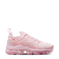 Women’s pink Nike running sneakers with lace-up design and chunky translucent sole